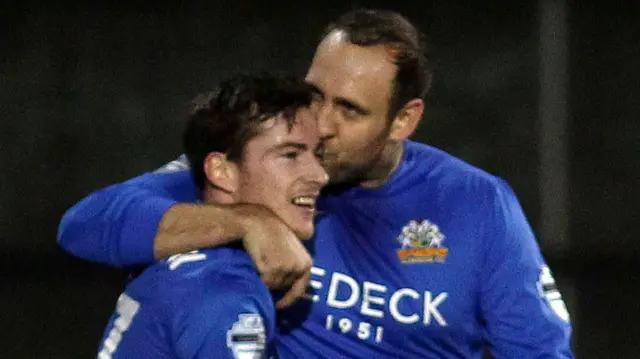 Andy McGrory makes it 2-0 and is rewarded with a smacker from Glenavon team-mate Guy Bates