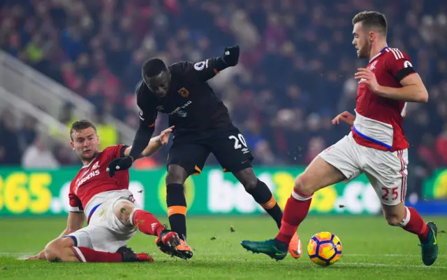 Adama Diomande is challenged by Ben Gibson and Calum Chambers