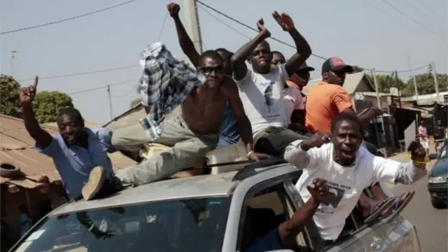 Gambians celebrate the victory of opposition coalition candidate Adama Barrow in the streets of Serrekunda, Gambia, on 2 December 2016Image copyrightAP Image caption There were scenes of jubilation in The Gambia after the result was announced