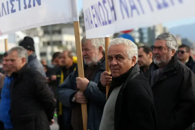 Greek seamen carry banners and placards as they rally in the port of Piraeus, near Athens, Greece, 5 December 2016. The Greek seamen have been on strike since 2 December to express their anger over government plans to cut pensions and social security measures.