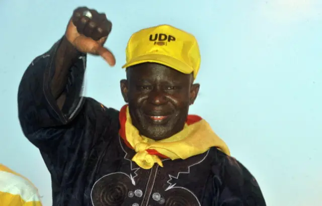 pposition candidate Ousainou Darboe salutes supporters during a campaign rally on November 22, 2011 in Banjul.