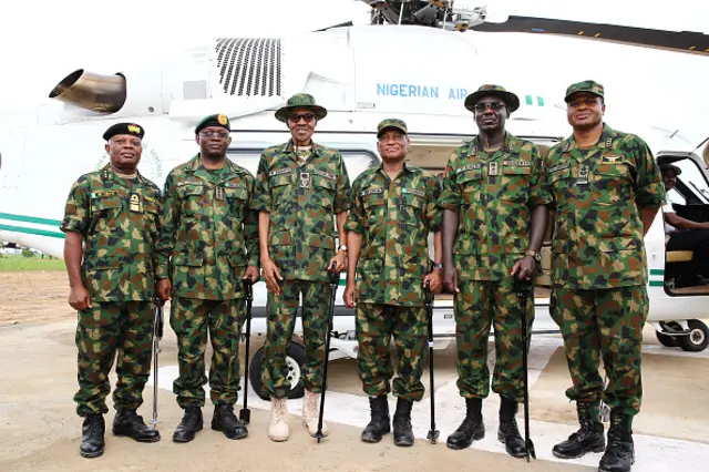 igeria's former military ruler President Mohammadu Buhari (3rd L) poses for a group picture with Nigeria's Senior military officer (from L) : Chief of Naval Staff Ibok Ekwe Ibas, Chief of Defence Staff General Abayomi Olonisakin, Minister of Defence Mansur Dan Ali, Chief of Army Staff Lt-General Tukur Buratai, and Chief of Air Staff Air Marshall Sadique Abubakar, during the Army Day celebration in Dansadau, northwest Nigerian Zamfara State, on July 13, 2016.