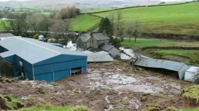 Landslide filling farmyard