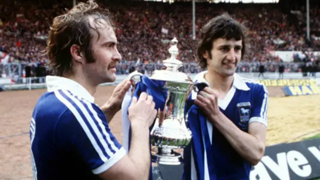 Mick Mills and Roger Osborne pose for a photograph with the FA Cup in 1978