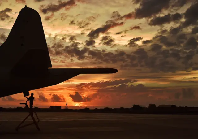 A German member of the European Naval Force makes technical checks to an anti-piracy reconnaissance plane as part of operation ATALANTA at the French military base in Djibouti on 5 May 2015