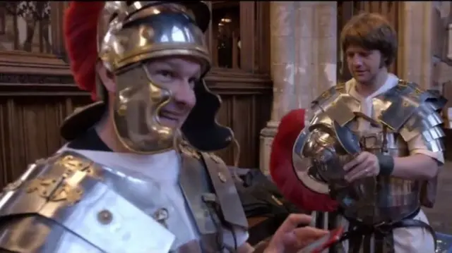 two men dressed in old Roman armour costumes