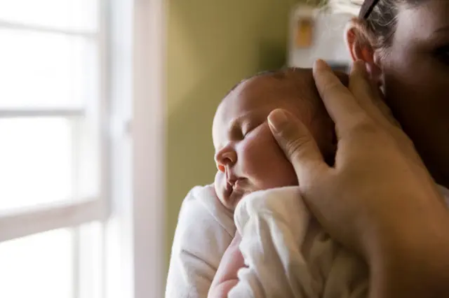 Mother holding baby