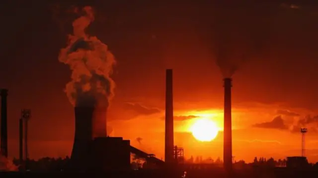 The sun sets behind the Scunthorpe steelworks