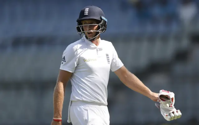 Joe Root leaves the field