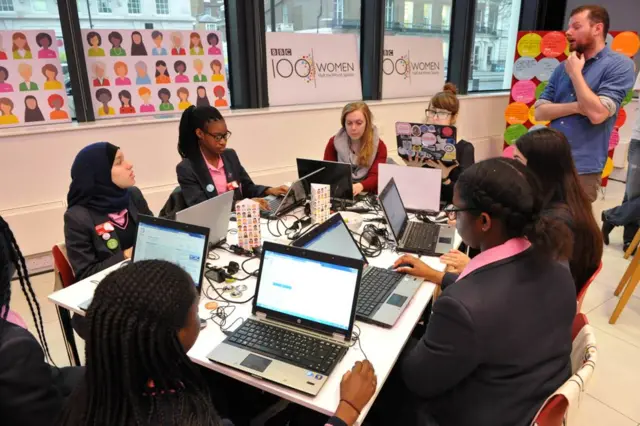 Schoolgirls using computers