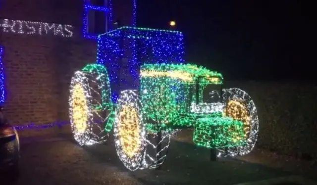 Tractor made of Christmas loghts