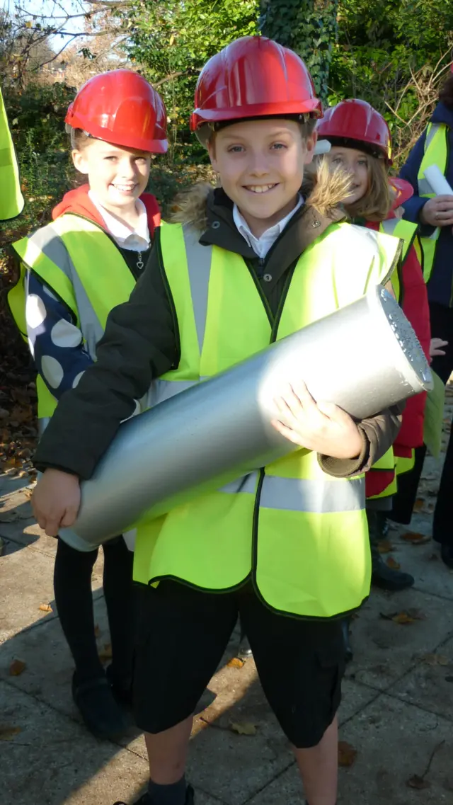 Pupil Alfie holds the capsule