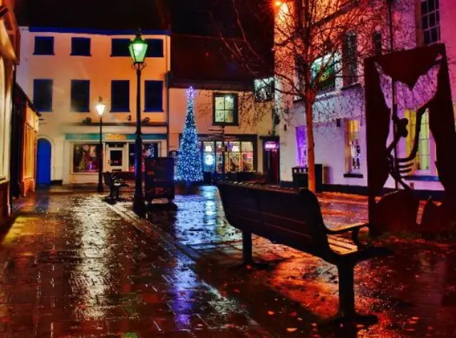 Butchers Row in Beverley lit up at night with a Christmas tree twinkling