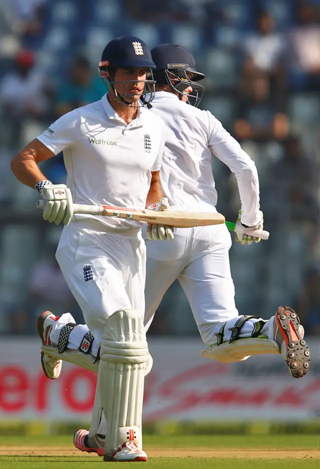 Alastair Cook and Keaton Jennings run between wickets during the Fourth test in Mumbai