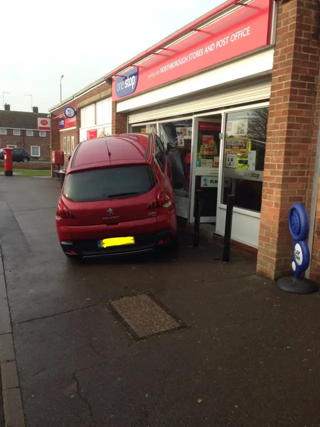 Car in shop front