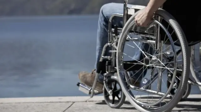 Wheelchair by the sea