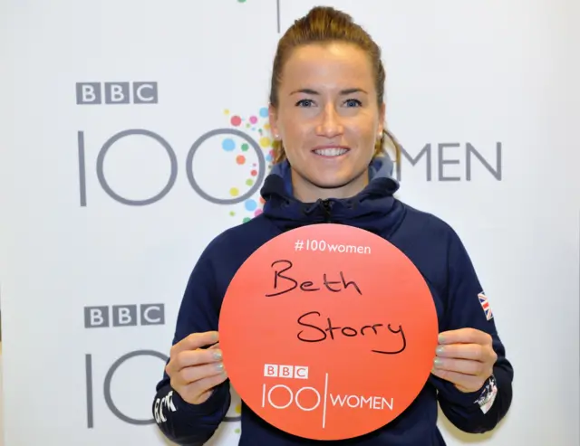 Maddie Hinch holding a badge saying 'Beth Storry'