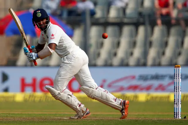 India's Pujara hits a boundary