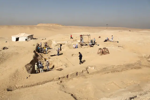 A handout picture released by the Egyptian Ministry of Antiquities on February 1, 2016 shows workers at the site where Czech archaeologists discovered an ancient funerary boat in the Old Kingdom necropolis of Abu Sir, southwest of the capital Cairo