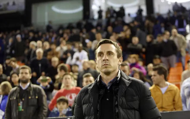 Gary Neville looks on