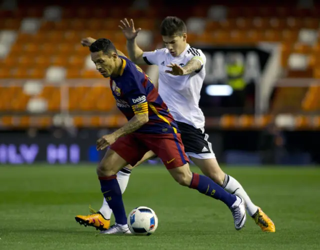 Adriano vies with Valencias forward Santi Mina