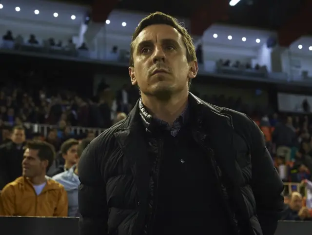 Gary Neville looks on