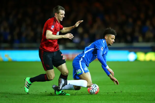 Gareth McAuley makes a tackle