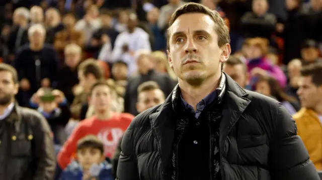 Gary Neville looks on