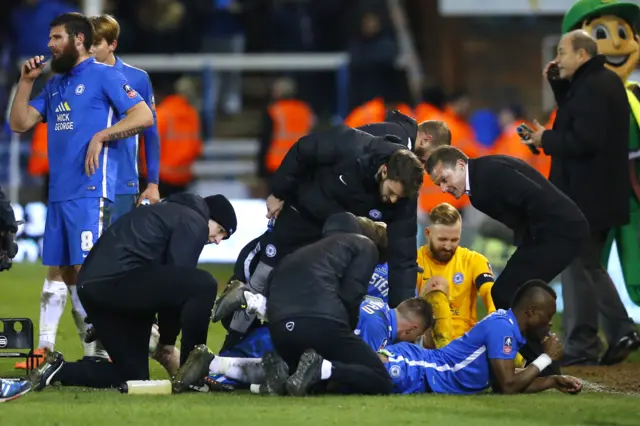 Peterborough players prepare for extra time