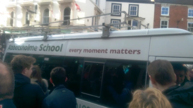 A school bus found itself in the thick of the Royal Shrovetide football game at Ashbourne yesterday