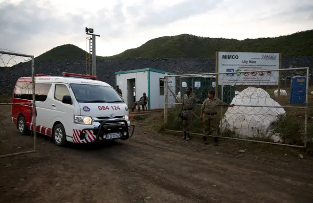 An ambulance leaves the Lily mine, which is owned by Vantage Goldfields, near Barberton, east of Johannesburg, February 5, 2016