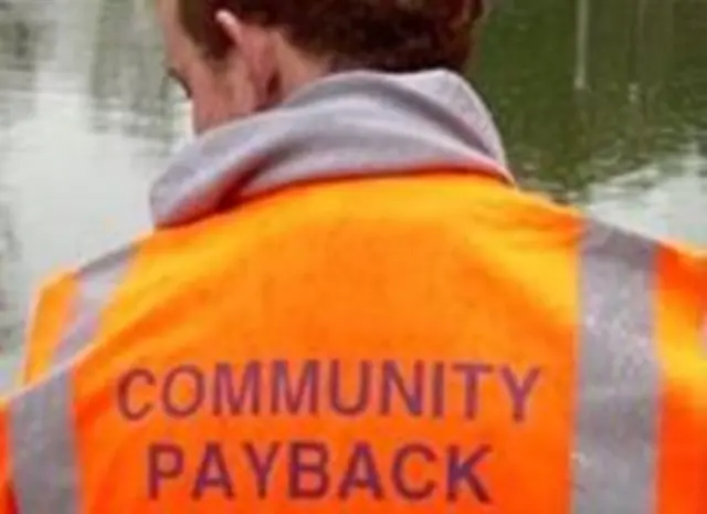 Man wearing community payback vest