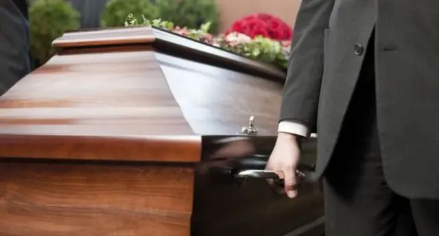 Men carrying a coffin