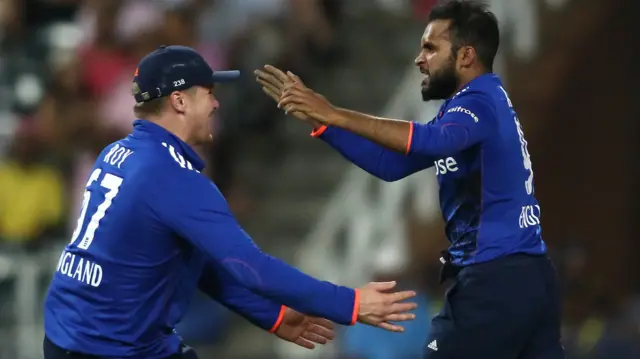 Adil Rashid celebrates with Jason Roy