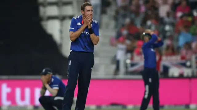 Stuart Broad reacts to a dropped catch