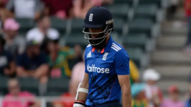 Moeen Ali walking