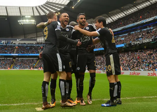 Leicester City players celebrate against Man City