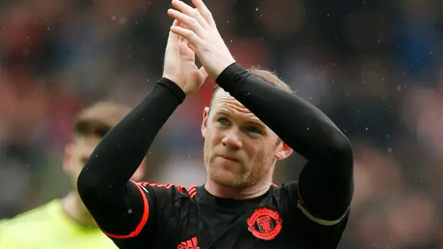 Wayne Rooney applauds