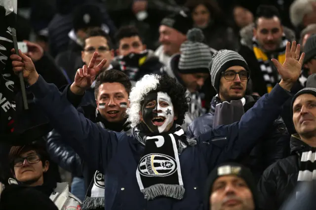 A Juventus supporter cheers