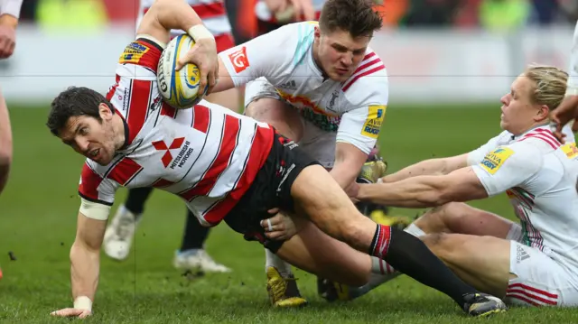 Gloucester's James Hook on the way to scoring his side's first try against Harlequins