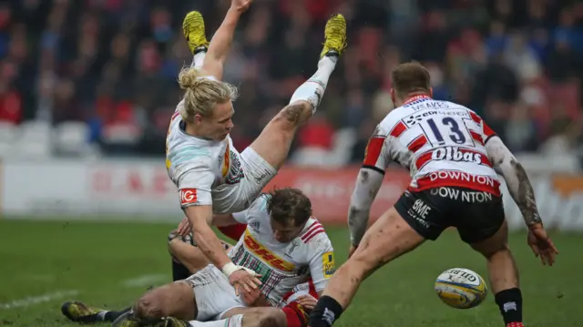 Matt Hopper and Nick Evans of Harlequins lose the ball