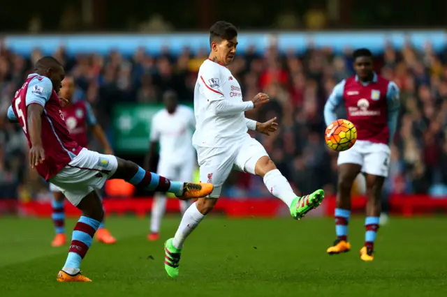 Jores Okore and Roberto Firmino