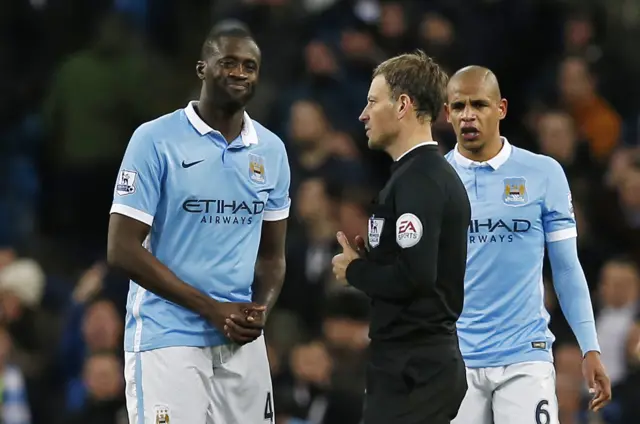 Yaya Toure speaks with Mark Clattenburg