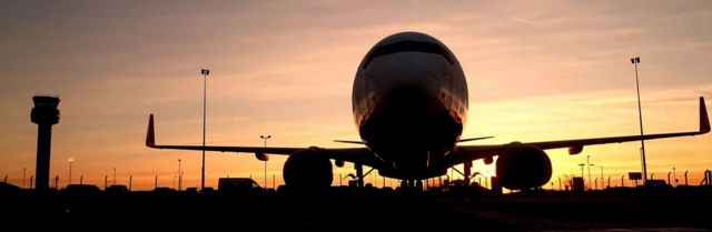 Sunrise behind a plane at East Midlands Airport