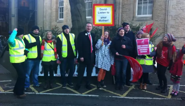 Protesters gather in advance of Oxfordshire council meeting to debate budget plan