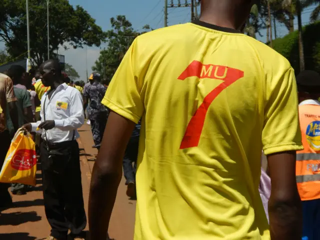 Man wearing Museveni t-shirt