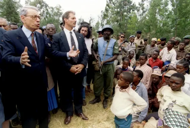 United Nations Secretary-General Boutros Boutros-Ghali talks to survivors of a massacre in Nyarubuye