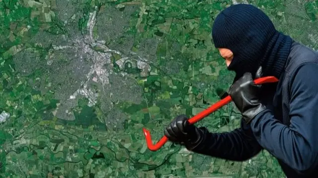 Burglar with a crowbar above a map