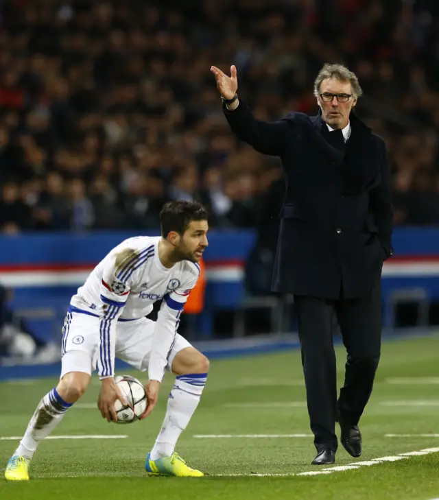 Laurent Blanc the PSG manager gestures towards Chelsea's Cesc Fabregas