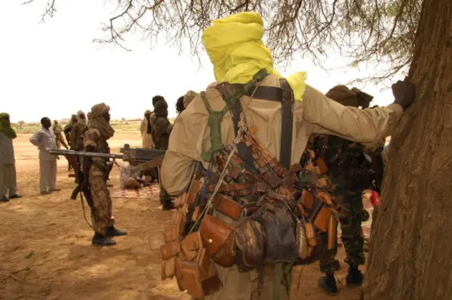 Sudan Liberation Movement (SLM) militants wait to receive the African Union mediator in the Darfur conflict, Salim Ahmed Salim, at the SLA-controlled Galoul locality in Jebel Marra area in North Darfur State, 31 August 2005